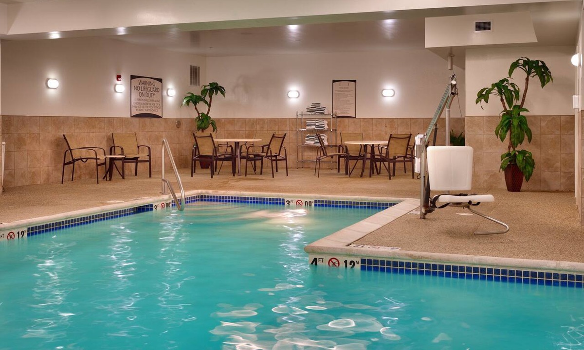 Omaha Condo | Free Breakfast. Pool. Gym. Near the Children’s Hospital!