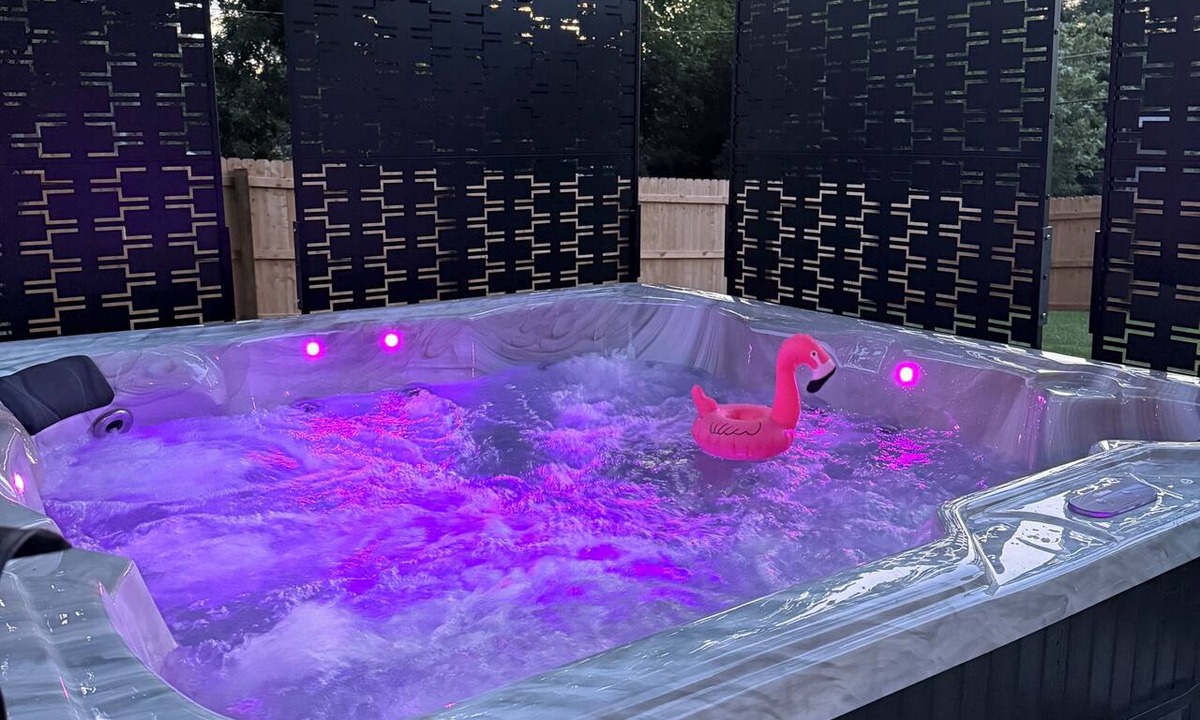 South Central Omaha House | Private hot tub + fire pit + screened in porch with character = your perfect starry nite escape