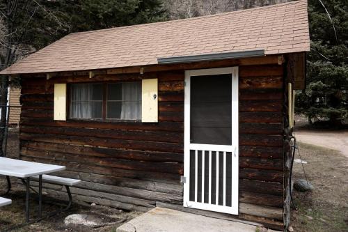 Bellvue House | Simple Country Cabin with Ornate Wood Stove in the Colorado Mountains of Poudre Canyon