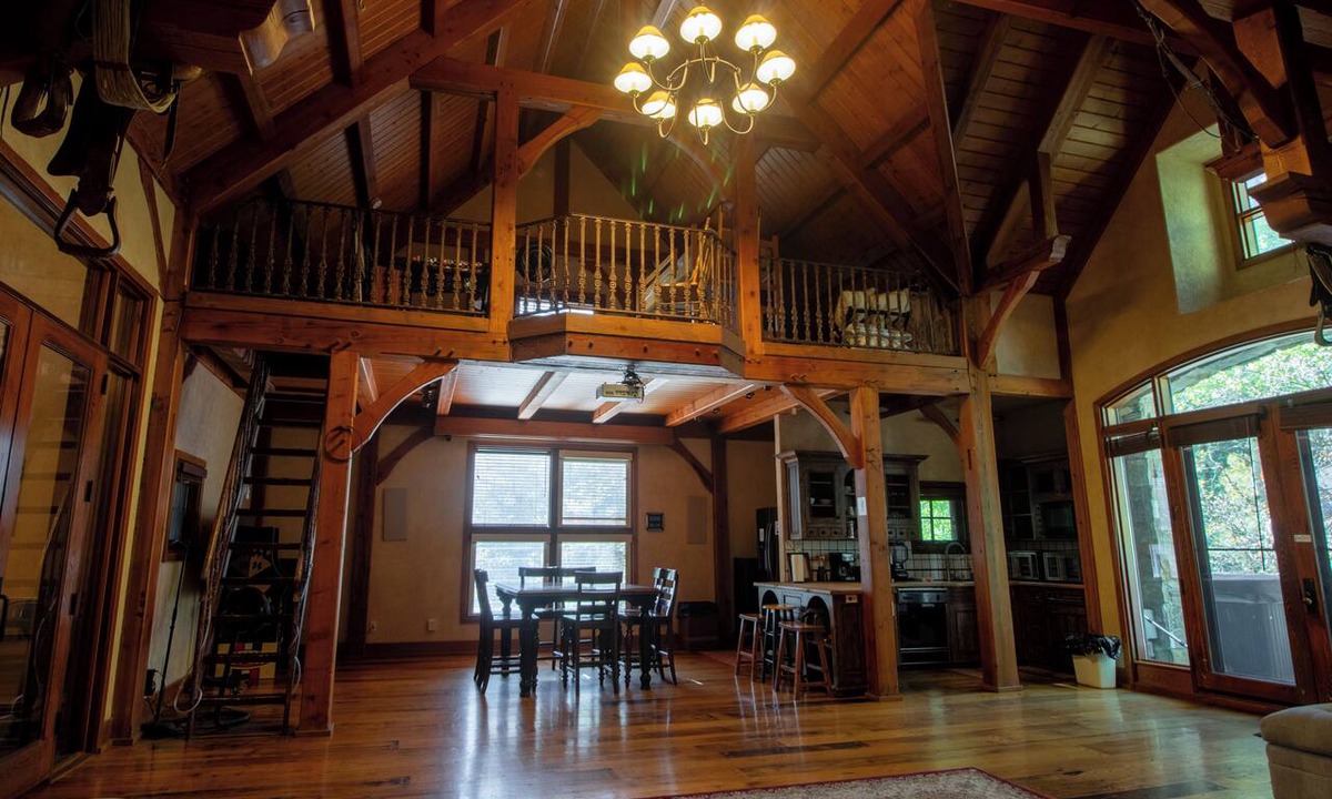 Sundance Cabin | Vaulted beam ceilings, a huge rock fireplace, stream nearby, large campfire area