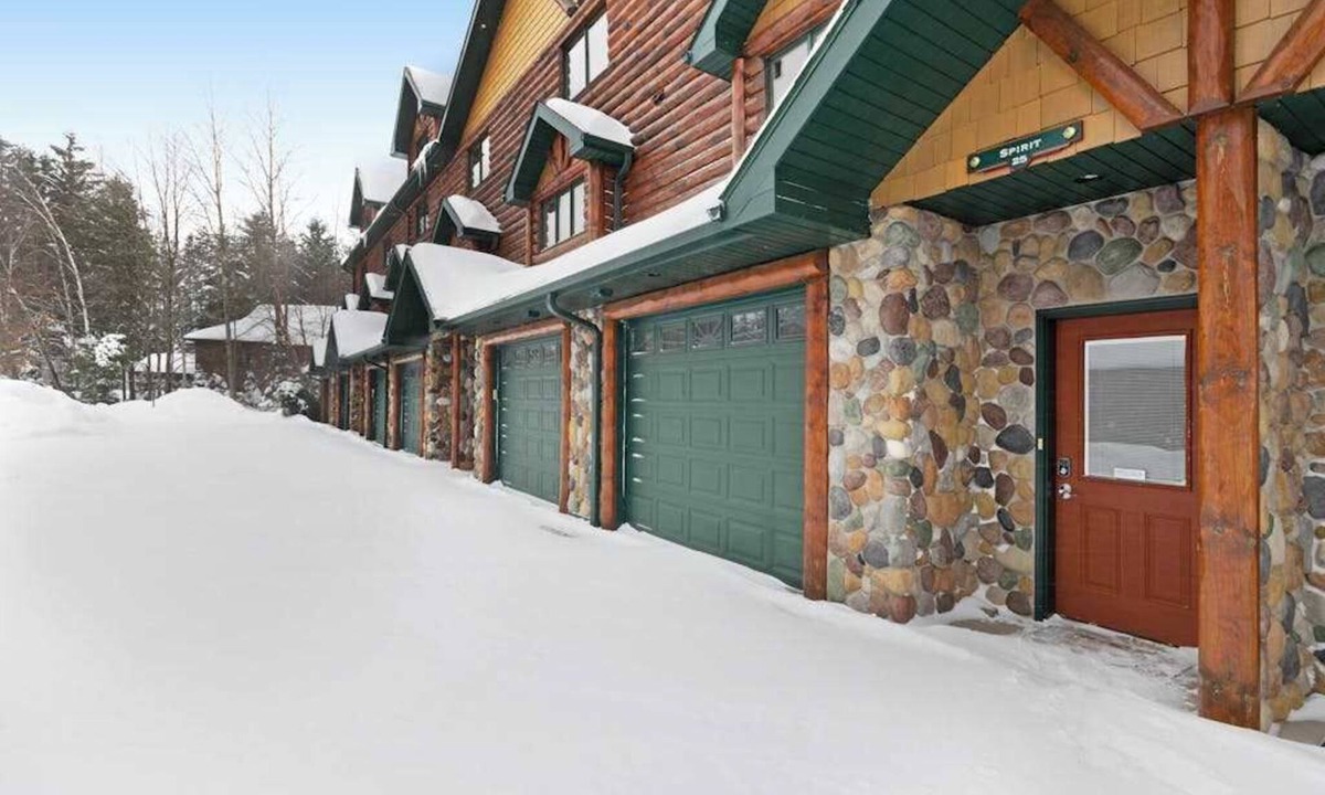 Eagle River Condo | Waterfront townhome with fireplace, private patio, & shared boat docks