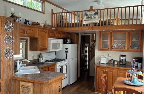 McGregor RV Rental | 1 bedroom, 2 loft Park Model in campground in Marquette, Iowa.