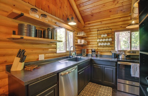 Breezy Point Cottage | 1 Mi to Beach & Lake: Breezy Point Cabin w/Yard!