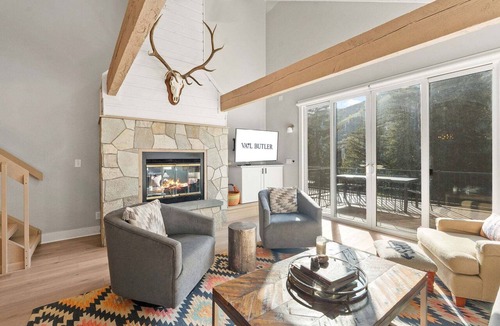 Highland Meadows Ski Chalet | 3BR West Vail riverfront duplex, hot tub, fireplace, yard