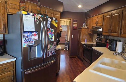 Olathe House | 4-bedroom house in Olathe w/fitness equipment and finished basement.