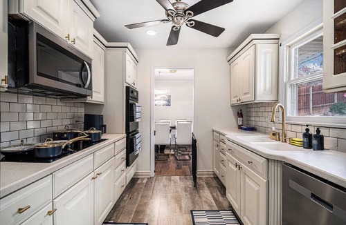 West Omaha House | A Touch of Luxury - Arcade, 5 TVs, Bounce House, Coffee Bar