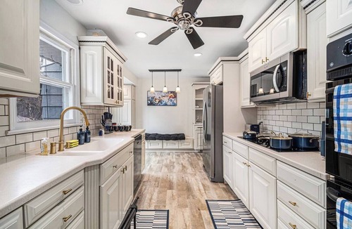 West Omaha House | A Touch of Luxury - Arcade, 5 TVs, Bounce House, Coffee Bar