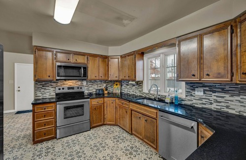 Topeka House | Charming 4BR family home w/private deck off master, big yard and patio