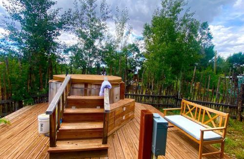 San Cristobal House | Charming Log Cabin Rental on Eco-Farm near Taos Ski Valley