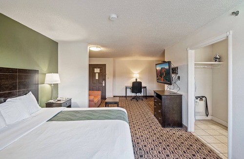 Wichita Hotel | Coratel Suites Deluxe 1 King Suite with Sofa Oversized Non Smoking