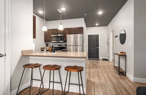 Lawrence Apartment | Downtown Lawrence Condo 1 Block to Mass St Walk to KU Hot Tub Sleeps 4