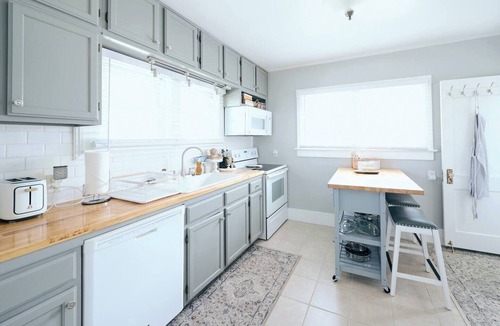 Sheridan House | Experience our elegantly renovated craftsman bungalow in Sheridan, a charming retreat just a two-block walk from historic downtown. Blending period character with modern comforts, this home comfortably fits 6 guests.