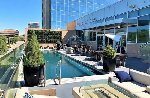 West Plaza Hotel | Family Getaway! 2 Spacious Units, Pool, Pets Allowed Near Rockhurst University!