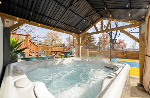 Shawnee House | Kansas Escape with Movie Room, Hot Tub, Mini Golf, Pickleball, Game Room & more!