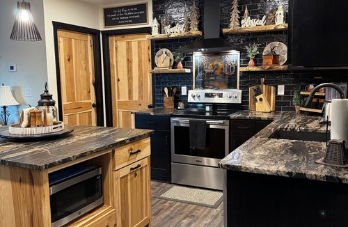 Crivitz Cabin | Luxury creekside cabin near High Falls with views, fire pit & trails nearby