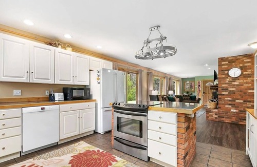 Drake Cabin | Luxury Riverfront Cabin Near RMNP with Hot Tub, Fire Pit, and Mountain Views