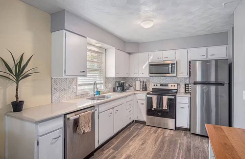North Central Omaha House | Modern 4BR NW Omaha, Garage, Fenced Yard, EV Charger, W/D, Pet-Friendly