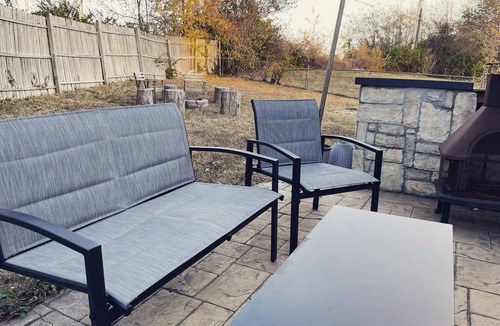 Liberty Cottage | Near Kansas City area cottage with a fire pit! Comfy beds and a stocked kitchen.