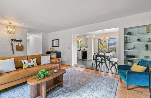 South Central Omaha House | Private hot tub + fire pit + screened in porch with character = your perfect starry nite escape