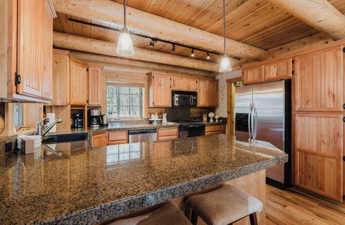 Three Rivers House | Riverfront log cabin style home with full kitchen, deck, washer & dryer and WIFI