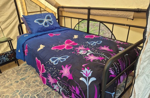 Waterloo RV Rental | Riverfront Serenity Glamping Tent in West Omaha Campground
