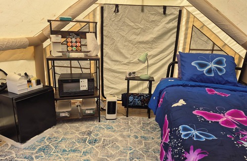 Waterloo RV Rental | Riverfront Serenity Glamping Tent in West Omaha Campground
