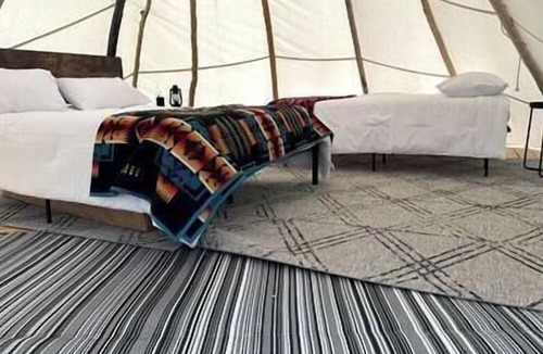 Fort Washakie RV Rental | Rustic Elegance: Tipi Glamping by Wind River Mountains in Fort Washakie