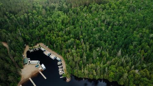 Babbitt House | Secluded Rustic-Modern Cabin with Rock Fireplace & Pine-Surrounded Deck Near Babbitt, Minnesota
