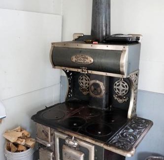Bellvue House | Simple Country Cabin with Ornate Wood Stove in the Colorado Mountains of Poudre Canyon