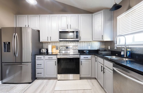 Chalco House | Spacious 4 bedroom house with AC, WiFi in, 2 living rooms, fenced, 2 car garage.