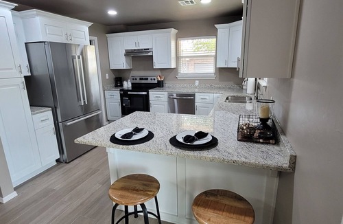 Guthrie House | Spacious 5-bedroom house with covered parking and private backyard in Guthrie.