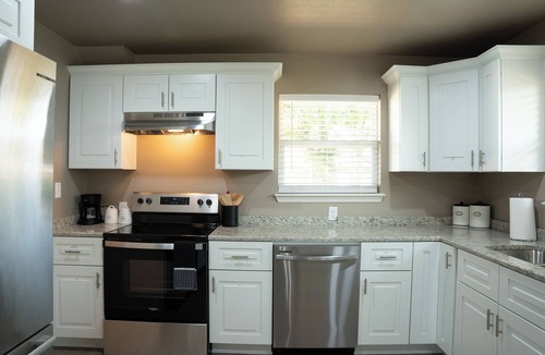 Guthrie House | Spacious 5-bedroom house with covered parking and private backyard in Guthrie.