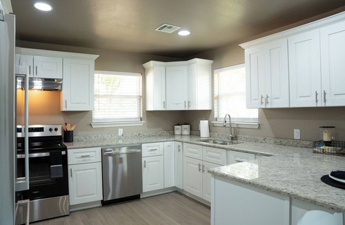Guthrie House | Spacious 5-bedroom house with covered parking and private backyard in Guthrie.