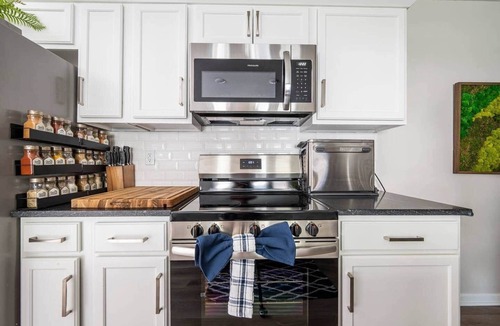 Lee's Summit House | The Blue Villa - Hot Tub, Fire Pit, Game Room, EV Charger, Walk to DTWN LS
