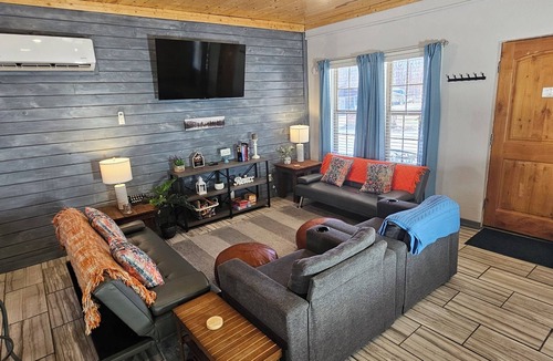 Dunnegan House | Unplug and unwind at this 2BR/2BA Hideaway, just a short walk to a swimming/fishing cove, backing to peaceful Corps land. Enjoy mornings in nature, afternoons by the water, and evenings around the firepit—perfect for couples, families, or friends!