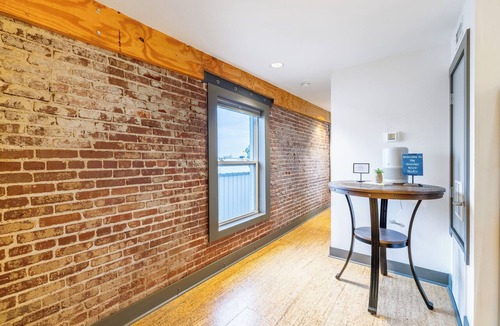 Rogers Apartment | Urban Brick Loft Studio Ride to Trails Walk to Dining, Shops & Nightlife