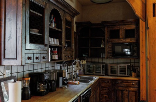 Sundance Cabin | Vaulted beam ceilings, a huge rock fireplace, stream nearby, large campfire area