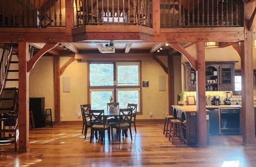 Sundance Cabin | Vaulted beam ceilings, a huge rock fireplace, stream nearby, large campfire area