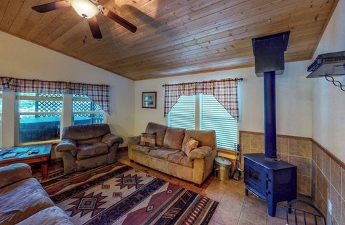 South Fork Cabin | Waterfront cabin with private hot tub, furnished deck, wood stove, & free WiFi