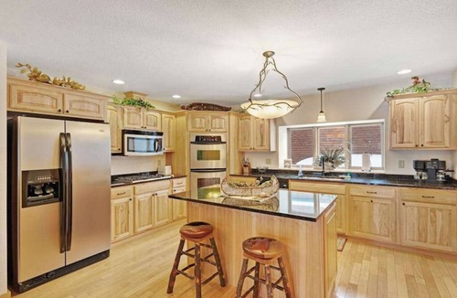 Eagle River Condo | Waterfront townhome with fireplace, private patio, & shared boat docks