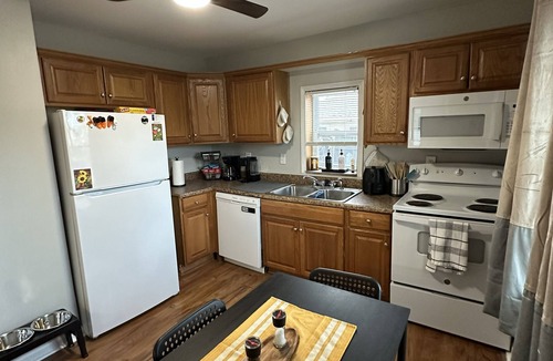 Overland Park House | Welcoming family feel enjoy a full kitchen, washer and dryer, and a pet friendly