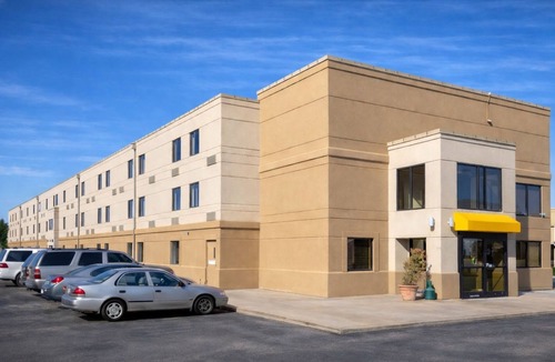 Greenwich Hotel | Woodland Inn & Suites Extended Stay - Deluxe 1 King Bed Non Smoking