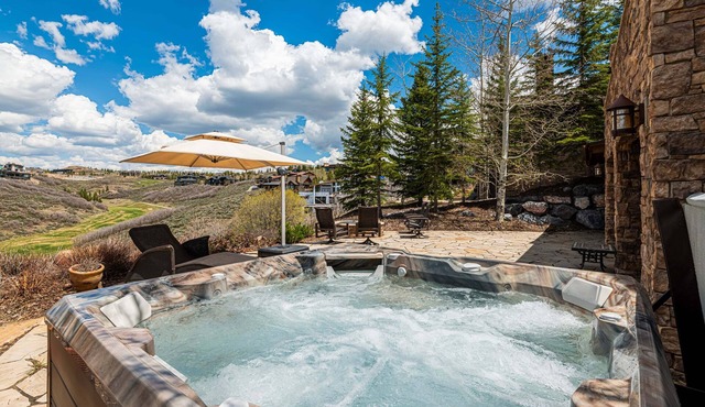Experience luxury in this 4-bedroom cabin with stunning limited mountain views in Park City.