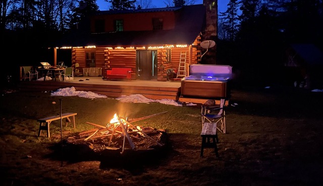 Pet-friendly log cabin with hot tub near hiking, fishing, etc.