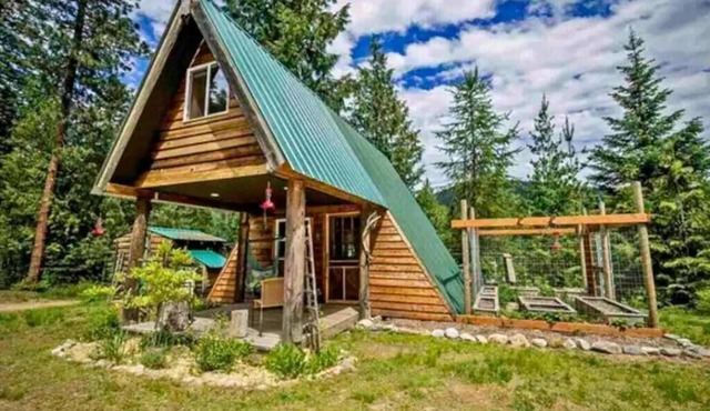 Pet friendly off grid chalet tucked away on a mountainside .