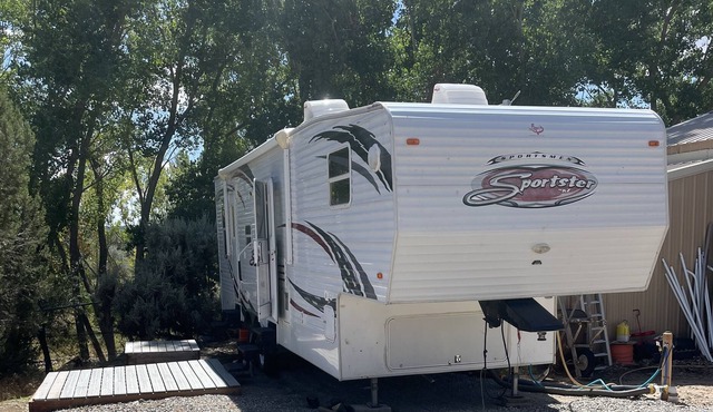 RV hookup next to our family friendly home. Between Aztec, NM and Durango, CO