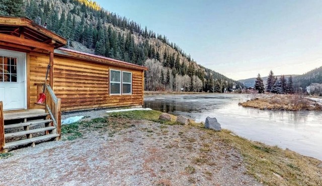 Waterfront cabin with private hot tub, furnished deck, wood stove, & free WiFi